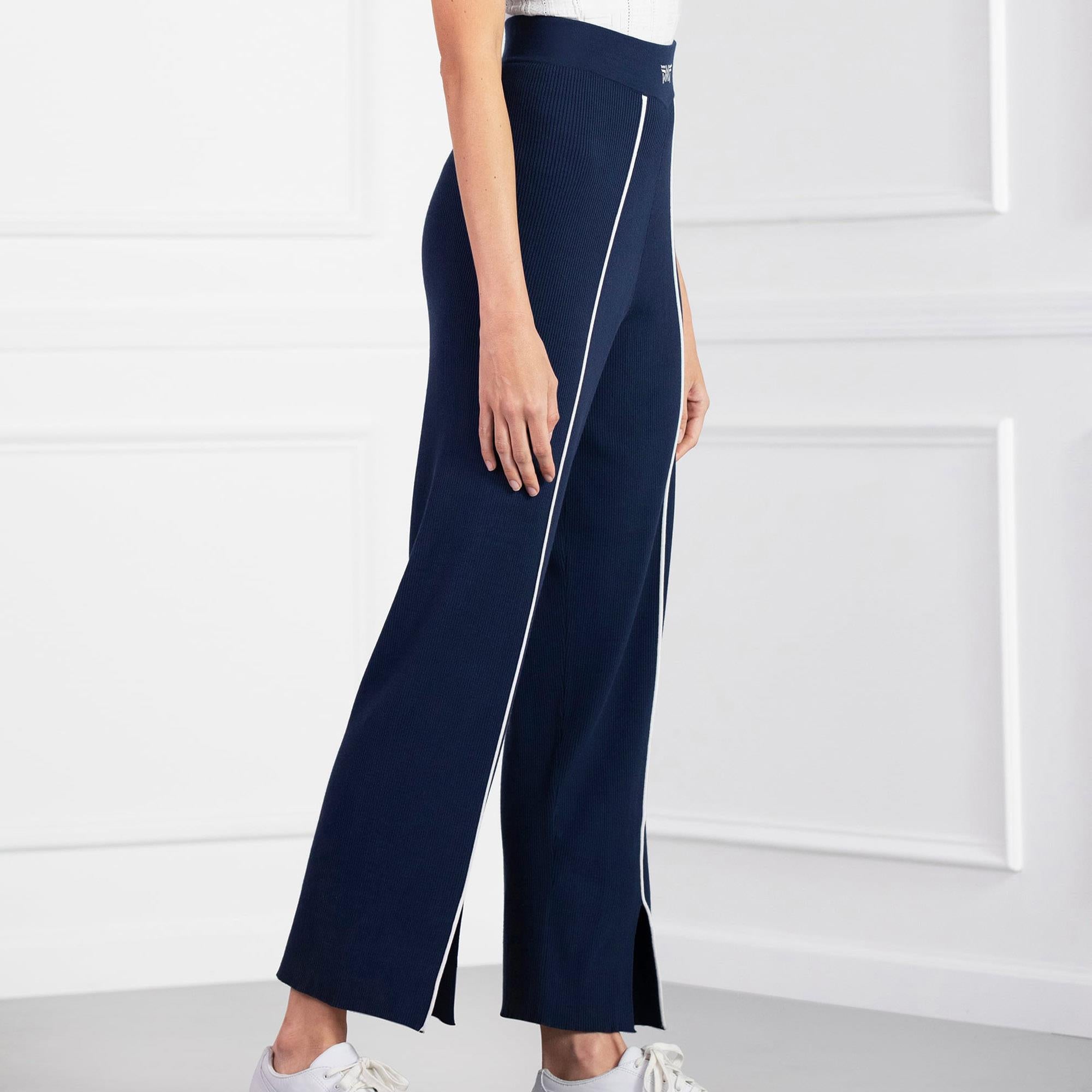 Angled view of model in PXG Contrast Seam Ladies Golf Pants, navy